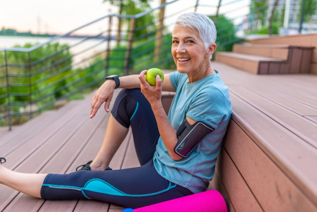 Woman holding apple