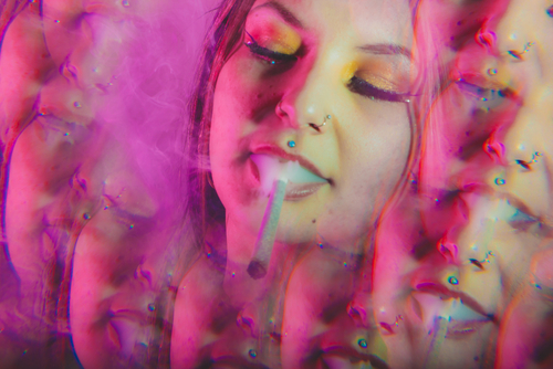 woman smoking weed while hallucinating