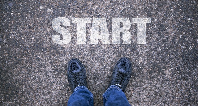 small man in road with the word start 2